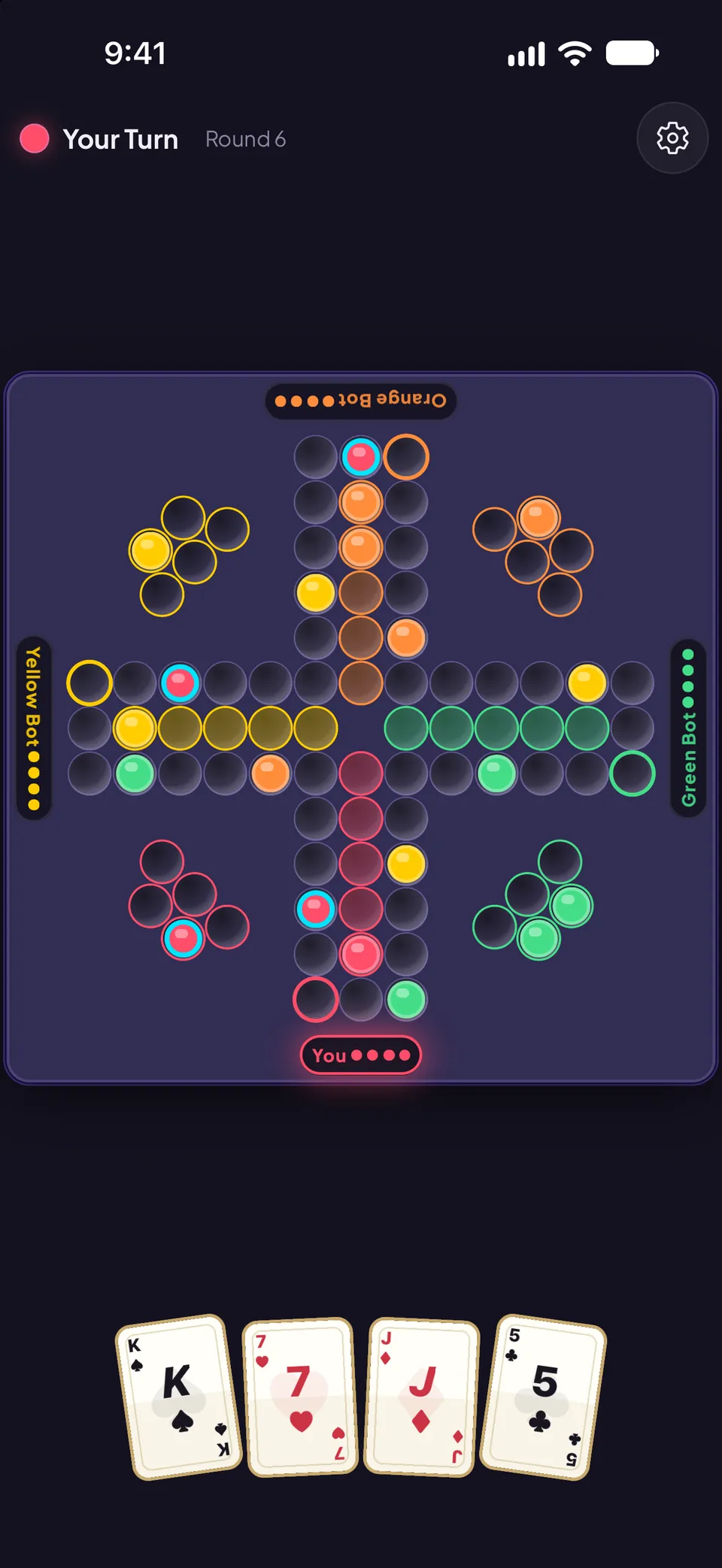 Back Up game board in round 6 of a 4-player match. A cross-shaped track of marble slots with colored home bases in each corner and colored safe-zone lanes leading to the center, seat labels for You, Yellow Bot, Orange Bot and Green Bot, and the player’s hand of four cards below: King, 7, Jack and 5.