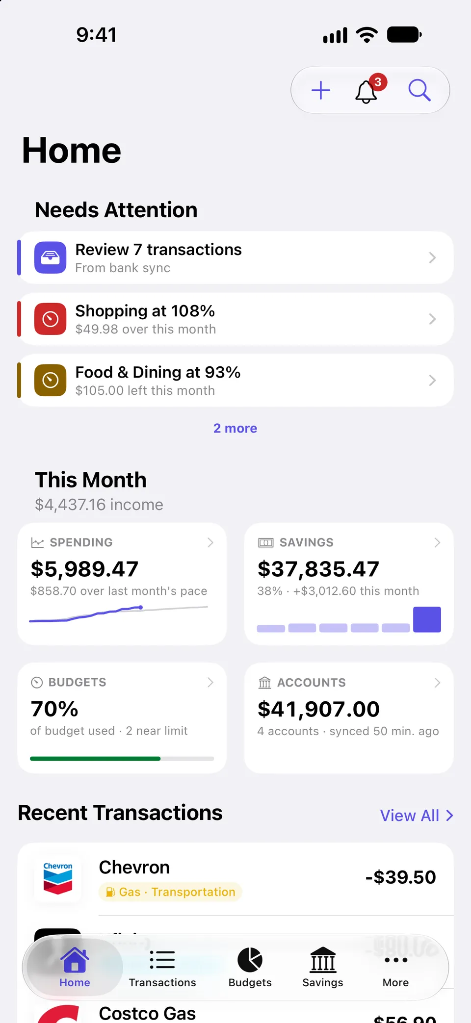 Balancely home screen. A Needs Attention list flags 7 transactions to review, Shopping at 108% of budget and Food & Dining at 93%. Below it are tiles for this month’s spending, savings, budgets and accounts, followed by recent transactions with merchant logos.